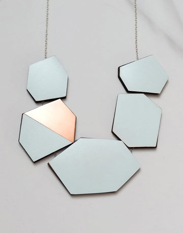 geometric statement necklace in copper and green formica