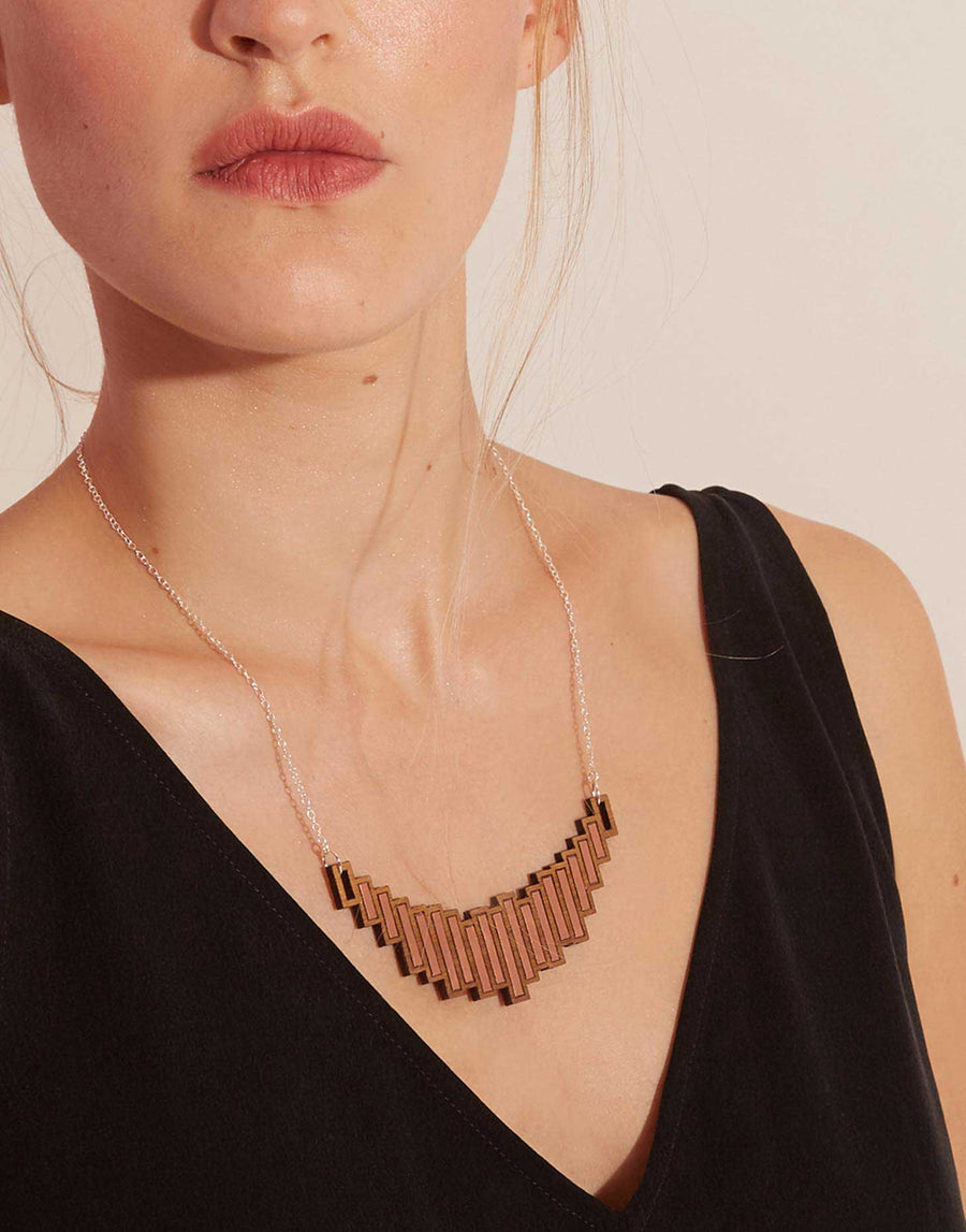 copper statement necklace on model