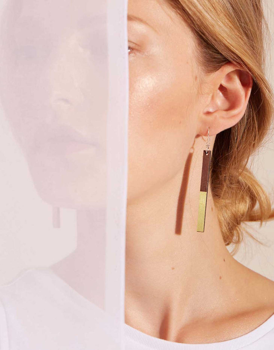 wooden earrings with brass on model