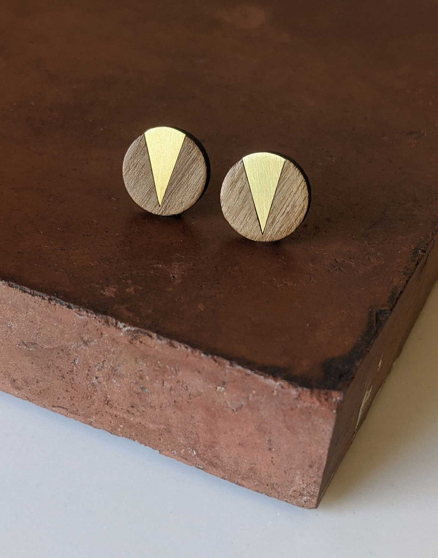 round wooden earrings with brass